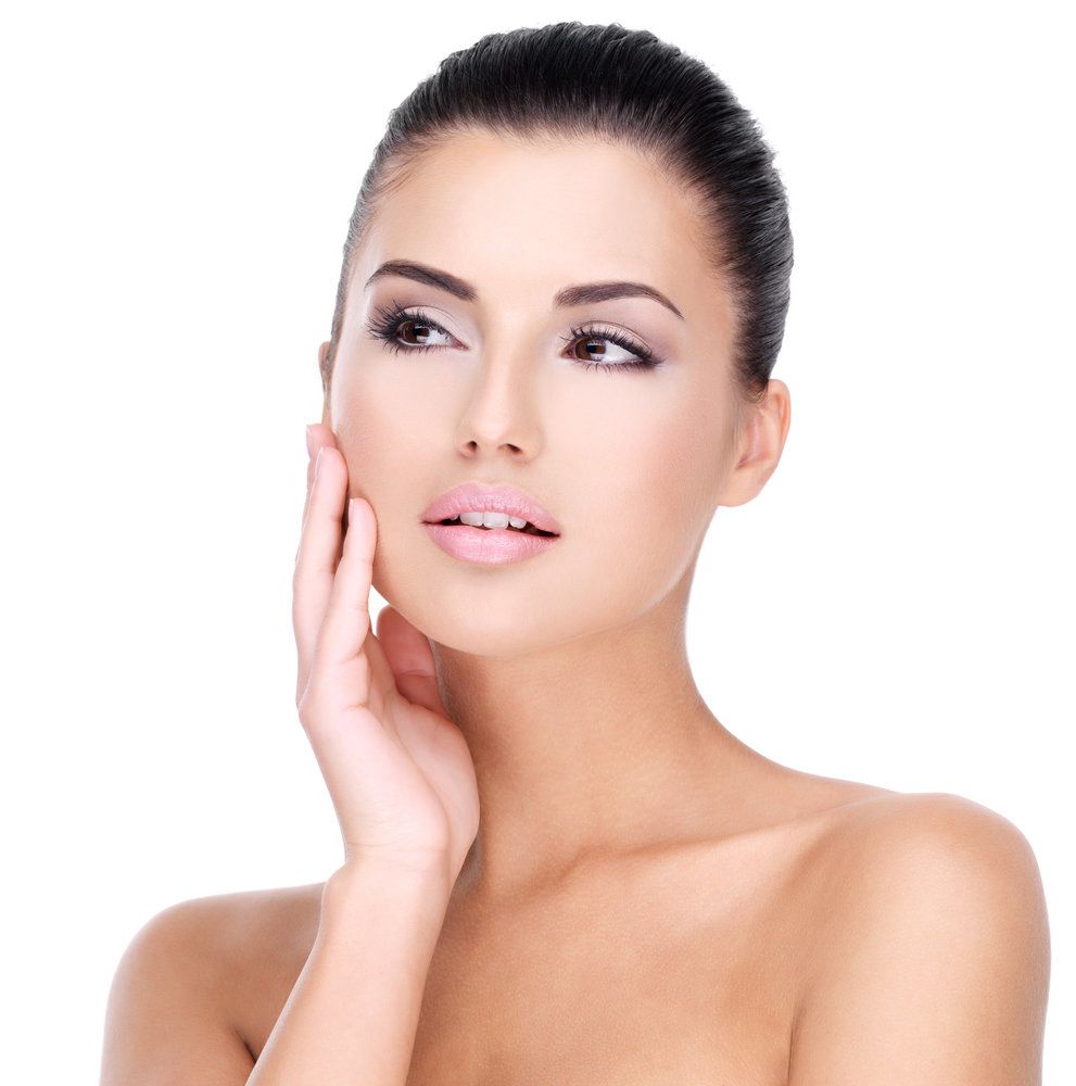 woman holding her hand to her cheek